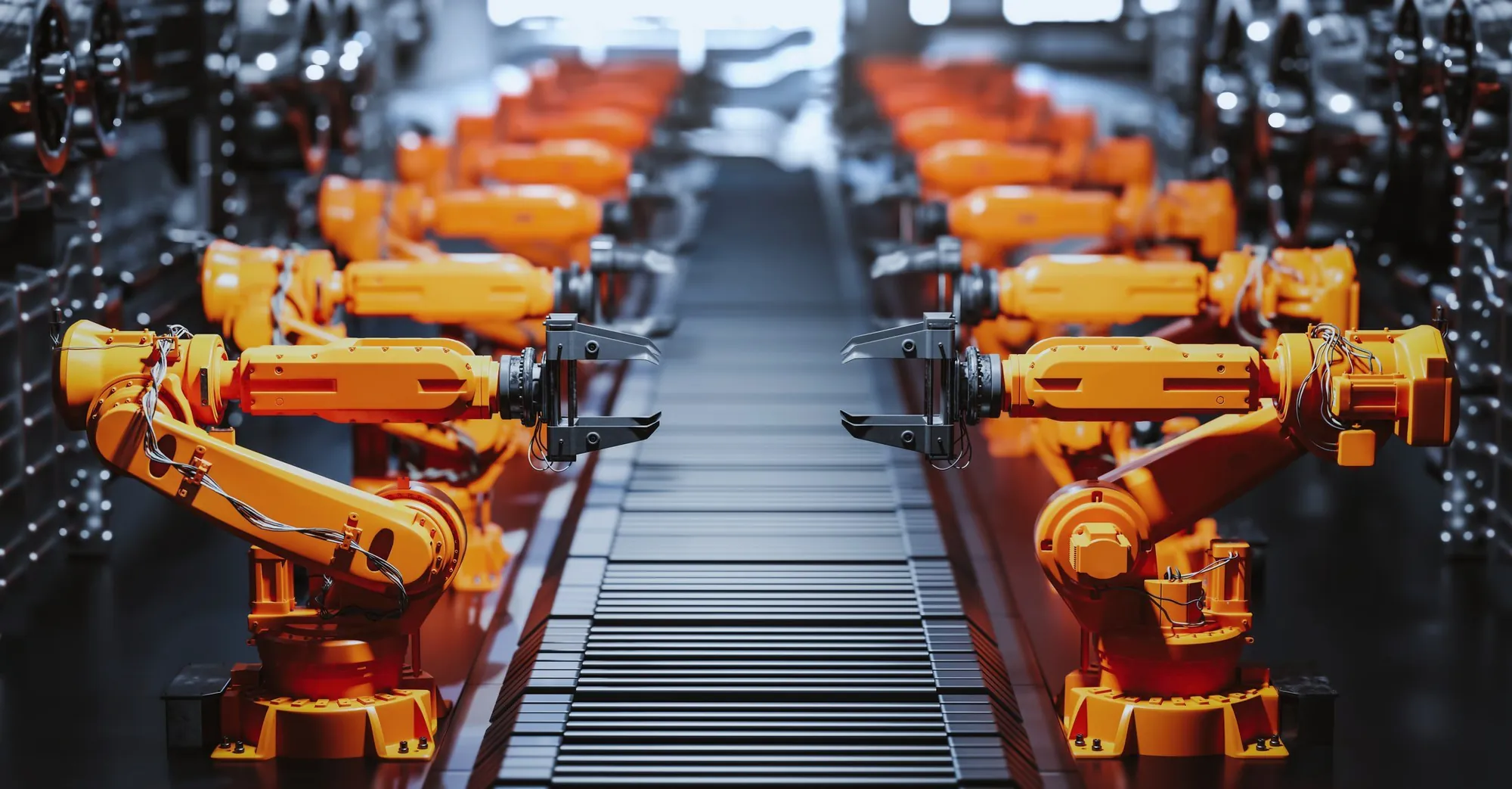 Robotic arms along an automated production line